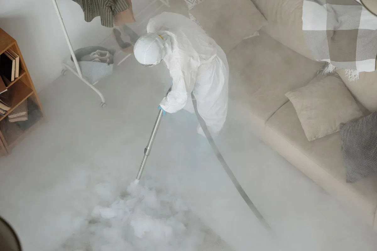 Biohazard cleanup technician in protective equipment, Lewiston, MN